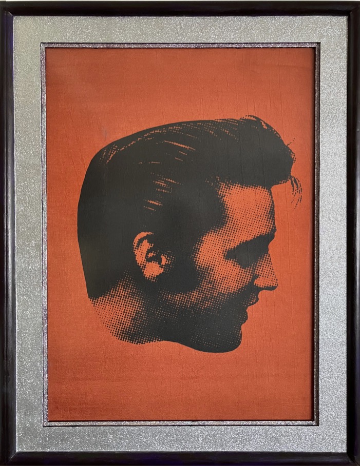 Framed print on red fabric